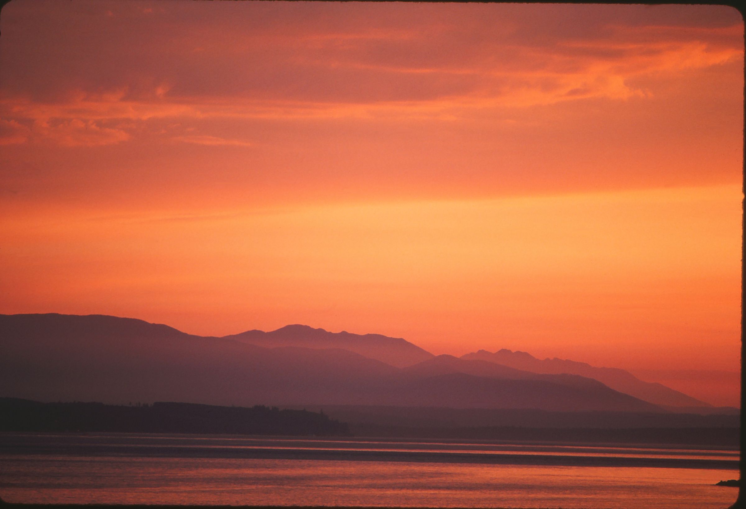 Orange sunset over mountain landscape